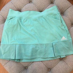 Adidas Tennis Skirt with attached shorts. Excellent condition. Never worn.
